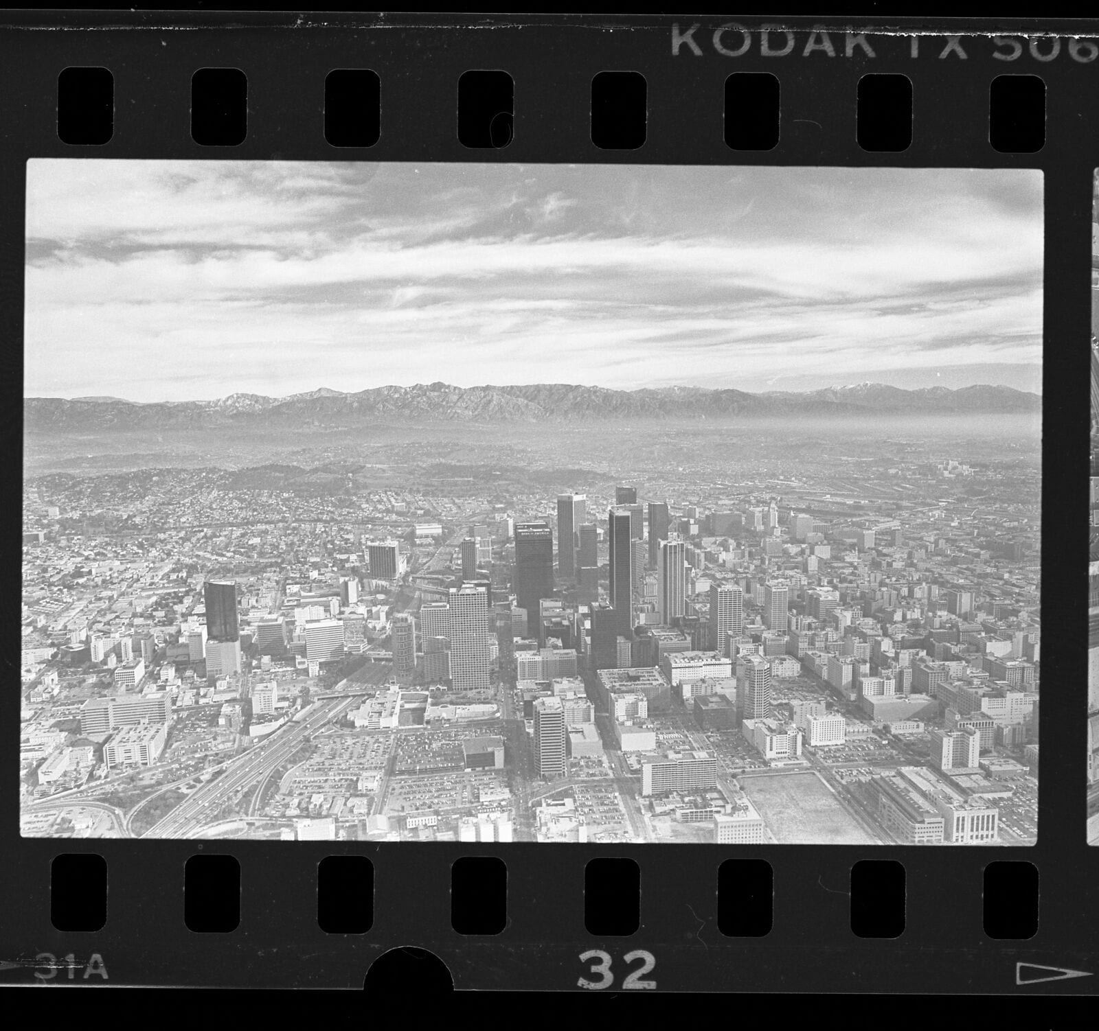 Aerial cityscape of mountains and downtown, Los Angeles, 1987, 1987, Los Angeles